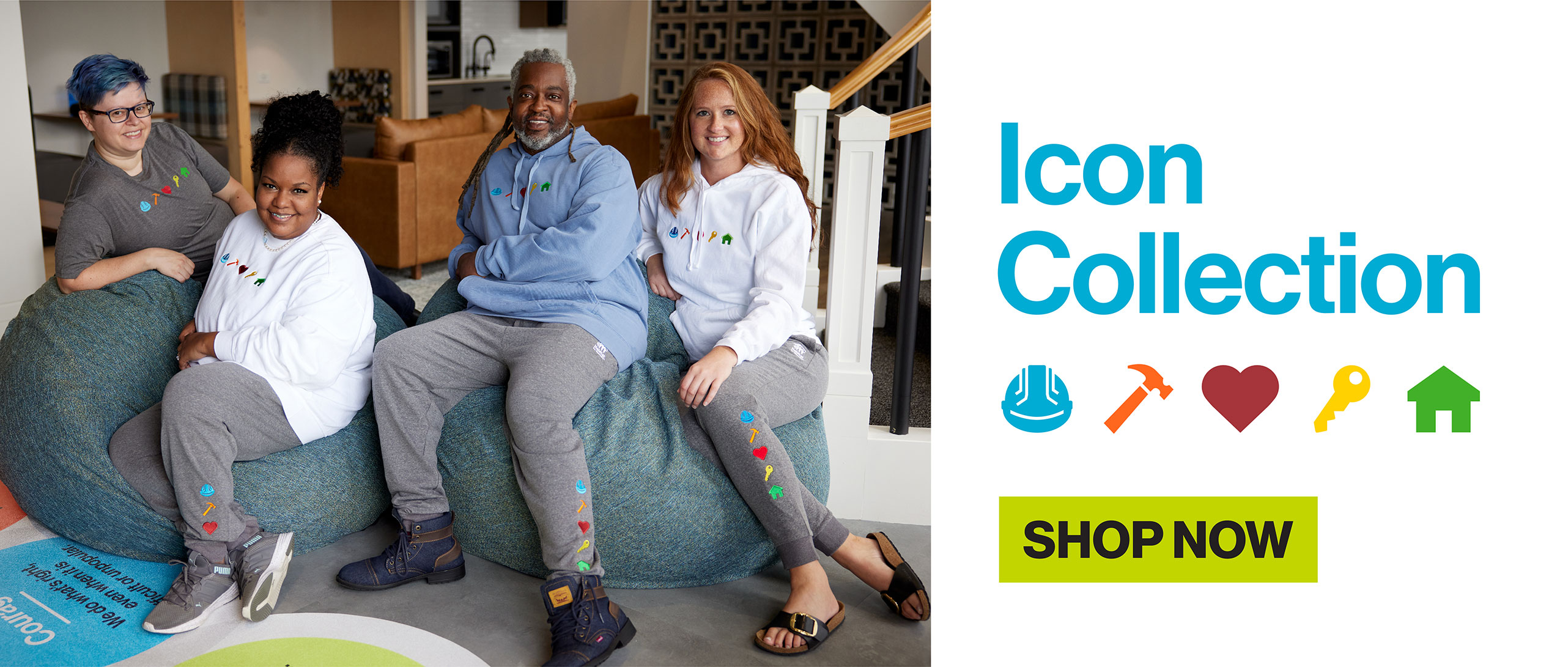 Group of people happily sitting together wearing habitat for humanity Icon collection apparel and fleece view icon collection products